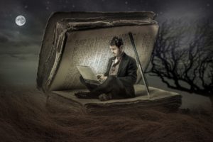 Digital humanist using a computer inside a book