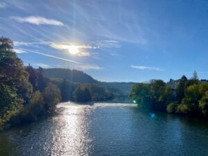 Besançon and the Doubs River in the sun, sparkling water and green hills